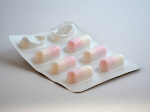 Oral Treatments for Erectile Dysfunction: Light background image with a pill pack on a flat surface.