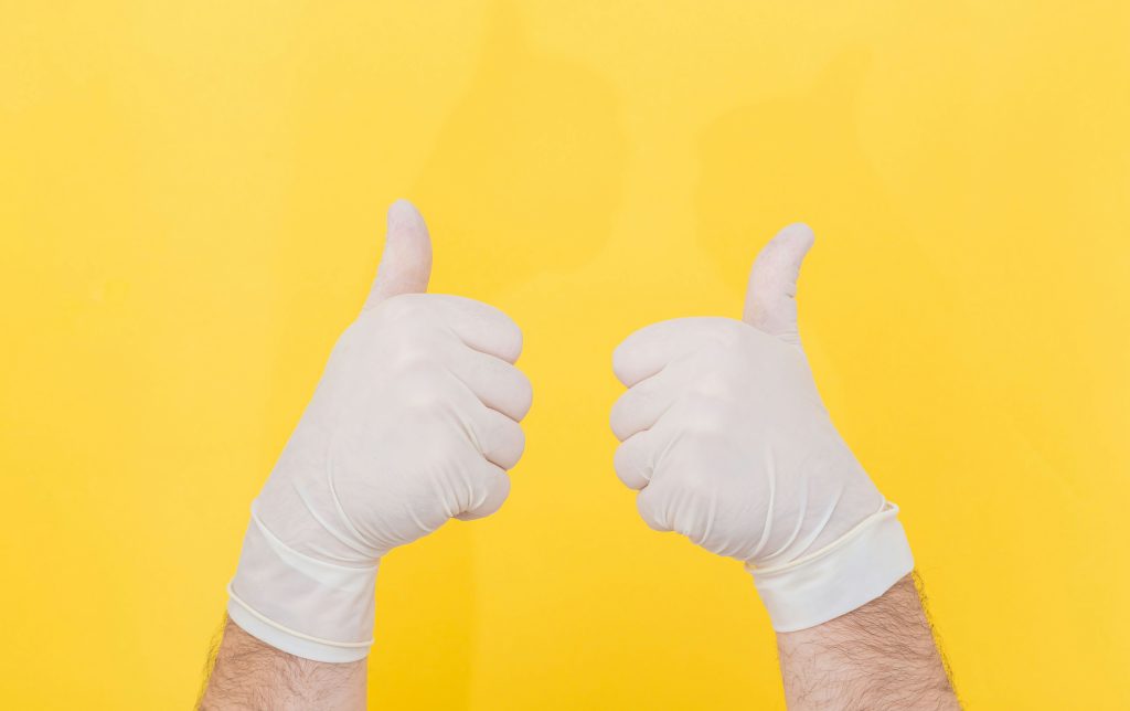 doctor's hands with thumbs expressing positivity in the treatment of paraphimosis