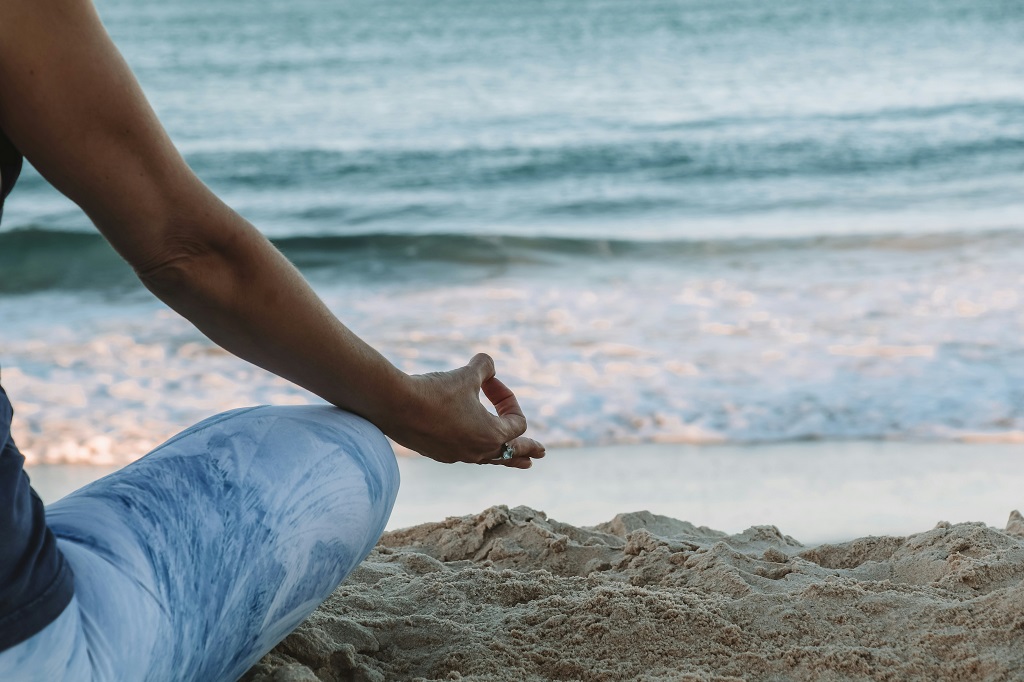 man meditating on the beach to illustrate treatment in text about pornography and erectile dysfunction