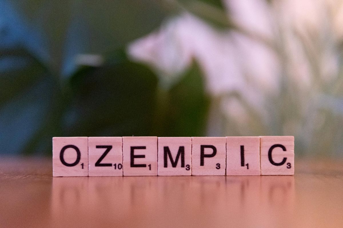 The word Ozempic spelled with wooden tiles on a table